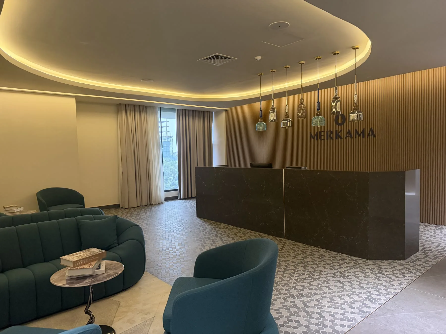 Merkama reception with its timber wall and black stone desk